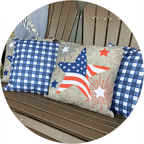 A throw pillow with red, white and blue stars.